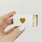 "Classic Heart Matchbox, Gold on White" - Matchbooks and Matches in white by Jessica Cunningham