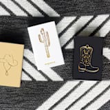 "Cowboy Boot Matchbox | Gold on Chocolate Brown" - Matchbooks and Matches in brown by Jessica Cunningham