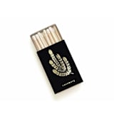 "Rosemary Matchbox, Gold on Black" - Matchbooks and Matches in gold by Jessica Cunningham