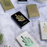 "Rosemary Matchbox, Gold on Black" - Matchbooks and Matches in gold by Jessica Cunningham