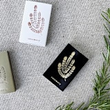 "Rosemary Matchbox, Gold on Black" - Matchbooks and Matches in gold by Jessica Cunningham