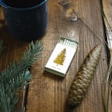 "Noble Fir Tree Matchbox, Gold on White" - Matchbooks and Matches in white by Jessica Cunningham