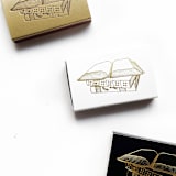 "Book Lover Matchbox, Gold on Black" - Matchbooks and Matches in black by Jessica Cunningham