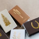 "Saguaro Cactus Matchbox, Gold on Rust" - Matchbooks and Matches in brown by Jessica Cunningham