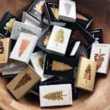 "Noble Fir Tree Matchbox, Gold on Black" - Matchbooks and Matches in gold by Jessica Cunningham