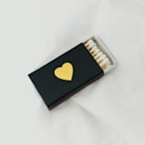 "Classic Heart Matchbox, Gold on Black" - Matchbooks and Matches in white by Jessica Cunningham