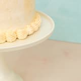 "Linen White Melamine Cake Stand- Large" - Cake Stands in yellow by Joyeux Company