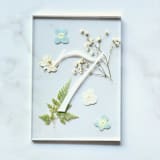 "Silver-Lined Pressed Flower Table Number, Blue" - Table Numbers in gold by Jasmine Jhunjhnuwala