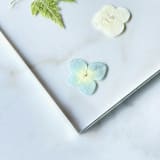 "Silver-Lined Pressed Flower Table Number, Blue" - Table Numbers in gold by Jasmine Jhunjhnuwala