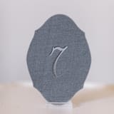 "Dove Script Oval Table Number" - Table Numbers in gray by Velvet Raptor