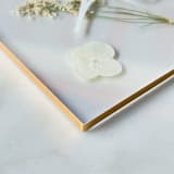"Gold-Lined Pressed Flower Table Number, White" - Table Numbers in gold by Jasmine Jhunjhnuwala