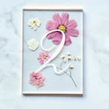 "Gold-Lined Pressed Flower Table Number, Pink" - Table Numbers in pink by Jasmine Jhunjhnuwala