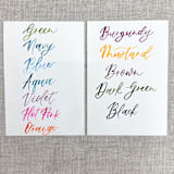 "Custom place cards with watercolor lettering | Tent place cards with modern calligraphy" - Place and Escort Cards in multicolorassorted-colors by Maria Ferrer G.