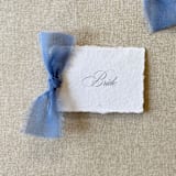 "Handmade Paper Place Cards with Dusty Blue Bow | Set of 10 | Custom Text" - Place and Escort Cards in blue by Cotton and Bow