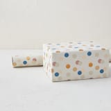 "Festive Dots" - Wrapping Paper Roll in Cream by Sumak Studio