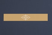 "Ornate Monogram" - Belly Bands in Faux Gold by Kristen Smith - Front