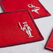 "Linocut Nutcracker" - Coasters in Burgundy by Teju Reval - Detail