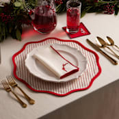 "Linocut Nutcracker" - Coasters in Burgundy by Teju Reval - Table Inspiration