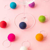 "Felt Ball Wine Charms in Acrylic Party Cube" - Drink Tags and Charms in multicolorassorted-colors by Dorrie Andrews