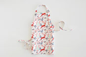 "Jumping Reindeer" - Personalizable Children's Apron in Red by Phrosné Barwood - Apron without personalization