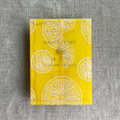 "White ink printed citrus celebration yellow vellum wraps for 5x7 card | pack of 10" - Invitation Jackets and Overlays in yellow by Ivory Invitations