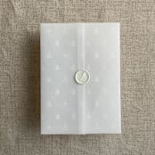 "White snow flake and forest vellum wrap for 5x7 card | pack of 10" - Invitation Jackets and Overlays in white by Ivory Invitations