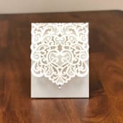 "Qty of 50 Ivory Shimmer Exquisite Laser Cut Pocket" - Invitation Pockets in white by Papel Custom Design