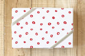 "Scattered dots" - Wrapping Paper in Holly Berry by Stacey Meacham - Front