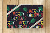 "Holly Jolly Merry Christmas" - Wrapping Paper in Midnight Black by Erika Firm - Front