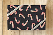 "Assorted Candy Canes" - Wrapping Paper in Coal by Hooray Creative - Front