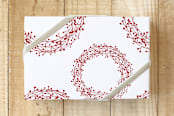"seasons bright" - Wrapping Paper in red lispstick by Neeta Sawhney - Front