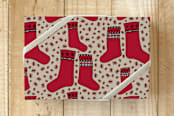 "Nordic Holiday Stockings " - Wrapping Paper in Scarlet by Lisa Travis - Front