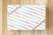 "Love Peace Joy & Happy Wishes" - Wrapping Paper in Candy Red by fatfatin - Front