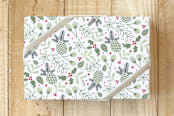 "Pinecones & Holly" - Wrapping Paper in Holly Green by Cavell Ferguson - Front