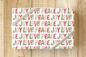 "Hand Lettered Joy Love Peace" - Wrapping Paper in Holly Berry by Kristen Magee - Front