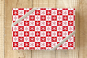 "Christmas Snowflakes" - Wrapping Paper in Christmas Red by Nathan Poland - Front