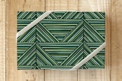 "Colorful Triangles" - Wrapping Paper in Moss by Amber Barkley - Front