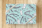 "Pine and Holly" - Wrapping Paper in Robin Blue by The Chatty Press - Front