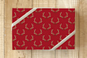 "Rustic Antlers" - Wrapping Paper in Red by Sara Berrenson - Front