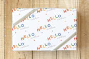 "Rainbow Sunshine Wrap" - Wrapping Paper in Rainbow by Three Wings North - Front