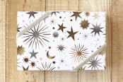 "Festive Starbrust" - Wrapping Paper in Gold and Silver by Faiza Khan - Front