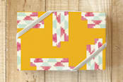 "Kwanzaa Kente Wrap" - Wrapping Paper in Kente Gold by Akweley Creative - Front