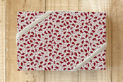 "Christmas Morning Holly" - Wrapping Paper in Creamy by Cavell Ferguson - Front