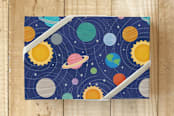 "Our Solar System Planets" - Wrapping Paper in Cosmic Blue by Carey Copeland - Front