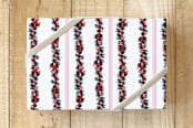 "Jingle Bell Bow Stripe" - Wrapping Paper in Peppermint Pink by Jenny Batt - Front