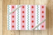 "Wavy Holiday Stripe" - Wrapping Paper in Peppermint Pink by Jenny Batt - Front