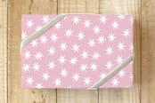 "Holiday Stars" - Wrapping Paper in Peppermint Pink by Jenny Batt - Front