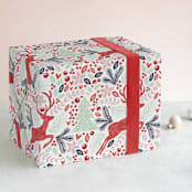 "Jumping Reindeer" - Wrapping Paper in Cardinal by Phrosné Barwood - Front