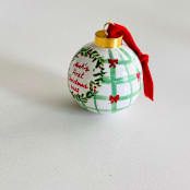"Personalized Hand-Painted “Baby’s First Christmas” Ornament – Red and Green Holiday Design" - Ornaments in green by Arohika Verma