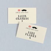 "Stache + Kiss" - Place Cards in Cream by Penelope Poppy - Front with Free Guest Printing